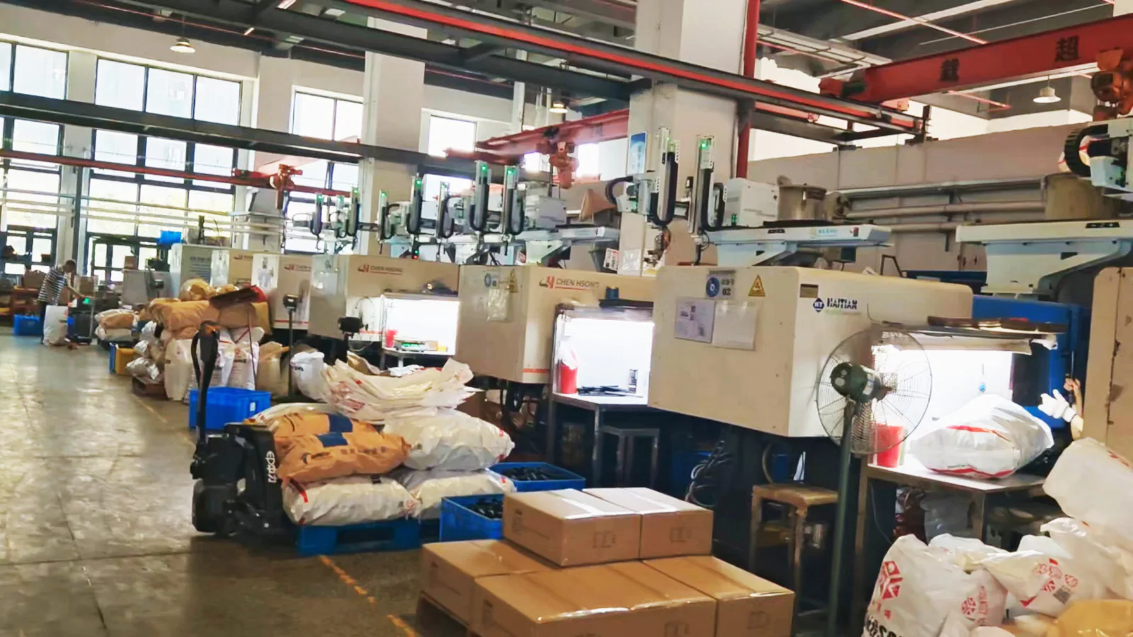 Injection molding machines operating inside the Vision Sports workshop