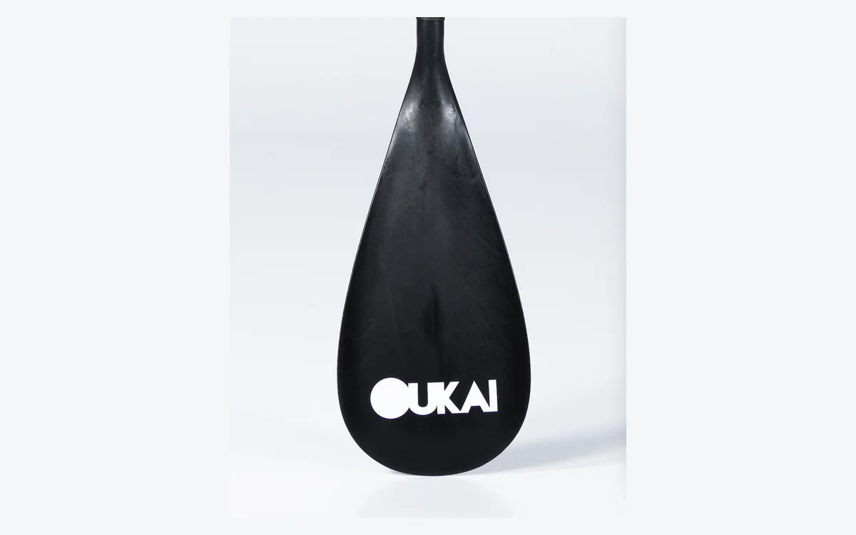 White OUKAI logo on a black paddle blade