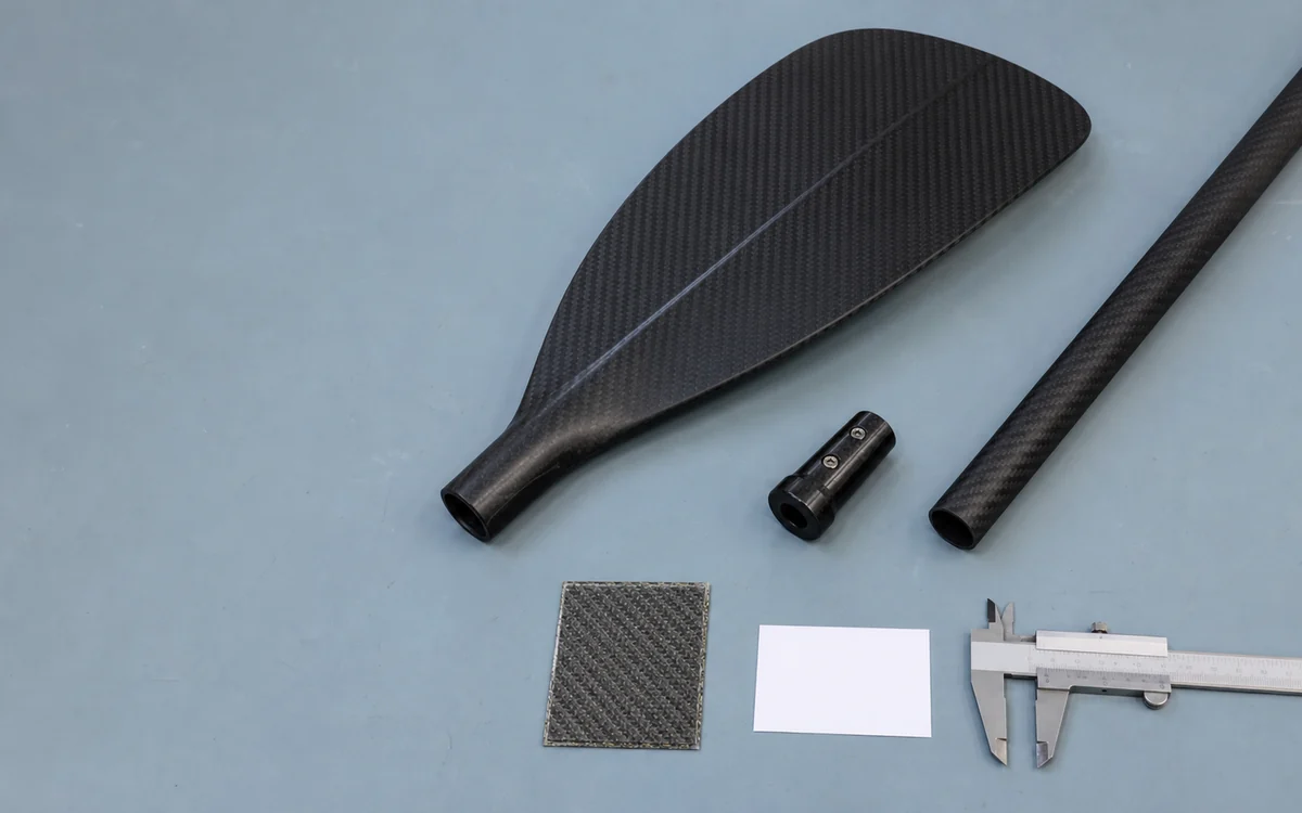 Carbon paddle blade, shaft and connection parts arranged for a construction claim review
