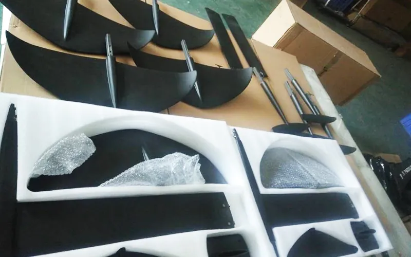 Protected water sports components arranged inside shipping cartons